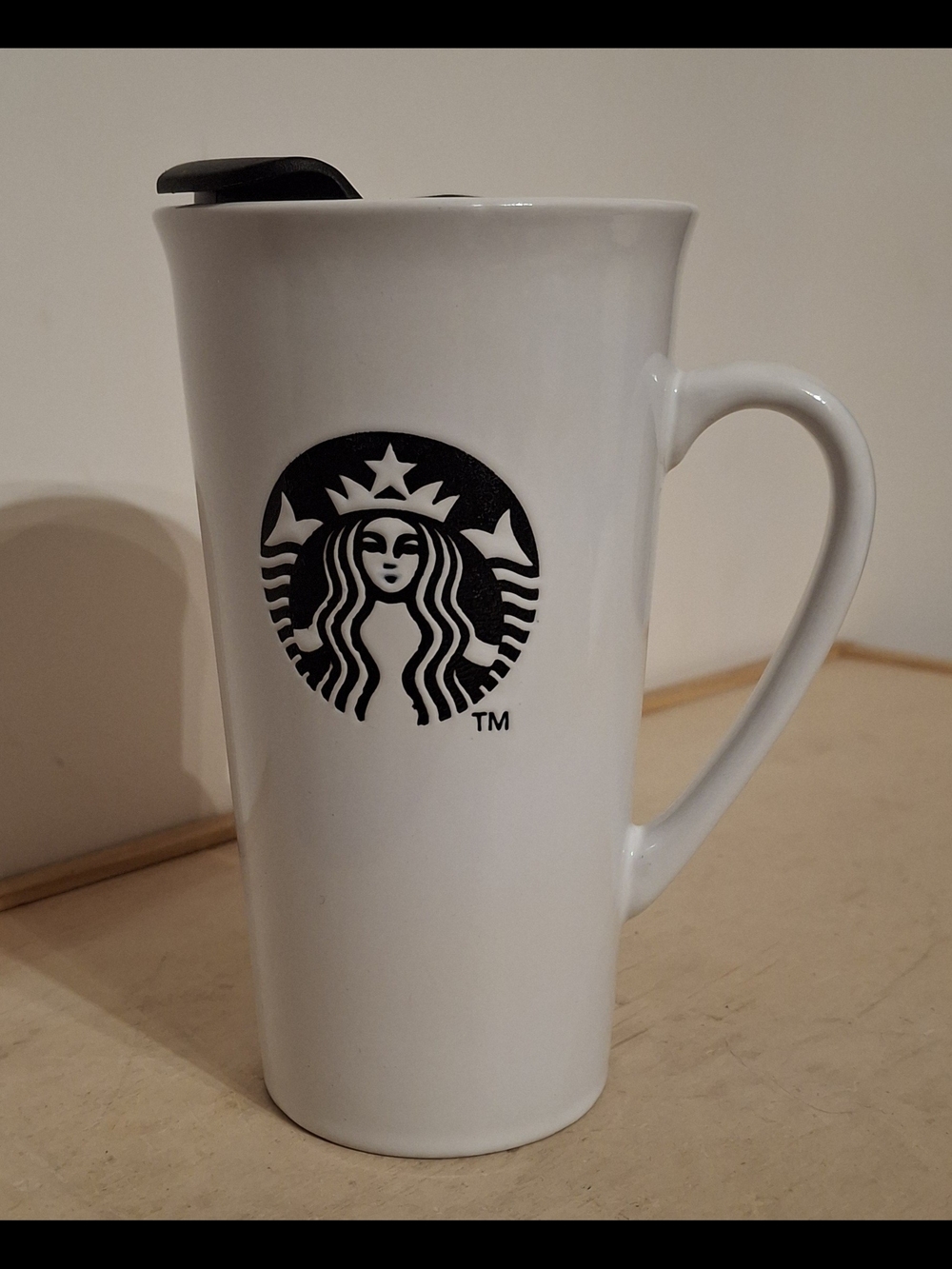 Starbucks 16oz Ceramic Travel Mug featuring a black embossed textured logo & lid